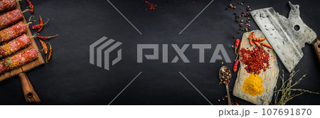 Raw kebab with pepper and spices 107691870