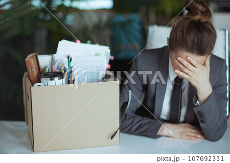 unhappy modern woman worker in modern green office 107692331