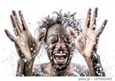 Close-up male portrait of a young attractive African American man laughing and splashing water. Happy black guy with curly hair in water drops. Generated by AI. 107692462