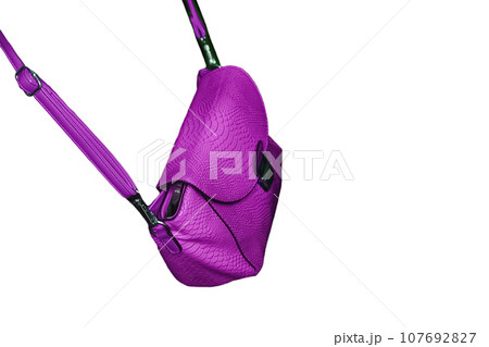 Women's fashion and style leather pink color bag with fish scale pattern on white background isolated 107692827