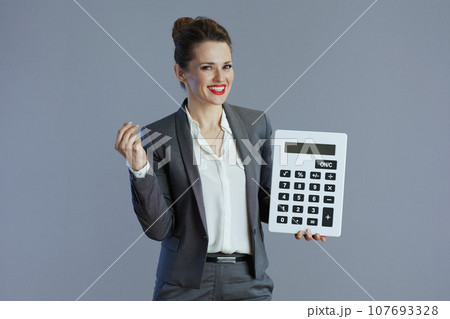 happy stylish business owner woman isolated on gray 107693328