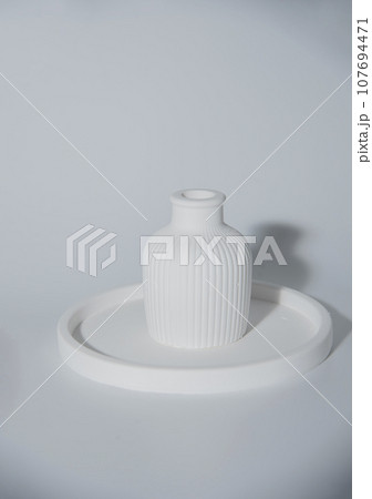 Small white ceramic vase.handmade symbolic ceramic figurines.Cozy home natural eco decor Small white ceramic vase.handmade symbolic ceramic figurines.Cozy home natural eco decor 107694471
