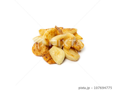 Fried Garlic Cloves Pile Isolated on White Background Fried Garlic Cloves Pile Isolated on White Background 107694775