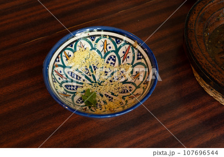 Dirty Moroccan Plate, Empty Bowl after Dinner, Finished Lunch, Oil and Smeared Sauce 107696544