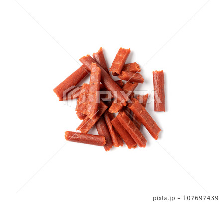 Fish Jerky Isolated, Dry Salted Seafood Snack, Hake Stockfish, Small Pieces of Dehydrated Pollock Fish Jerky Isolated, Dry Salted Seafood Snack, Hake Stockfish, Small Pieces of Dehydrated Pollock 107697439