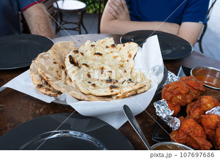 Indian Flat Bread Closeup, Traditional Flatbread also Known as Pita Bread, Roti, Chapati, Naan or Tortilla 107697686