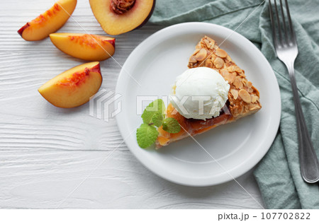 Homemade  galette with peaches. 107702822