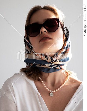 The square image of a girl in retro handkerchief The square image of a girl in retro handkerchief 107704159