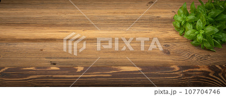 Fresh Basil on Wood Table Background, Green Basilic Bunch on Rustic Wooden Desk Plate 107704746