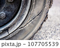 Close up of tire sidewall with damage, Car tire damage at container yard 107705539