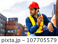 Warehouse engineer worker working at industrial container yard 107705579
