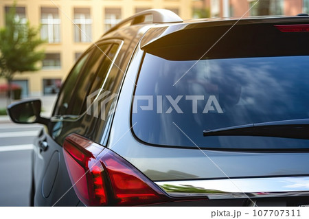 Back window of a car parked on the street, rear view. Mock-up for sticker or decals Back window of a car parked on the street, rear view. Mock-up for sticker or decals 107707311