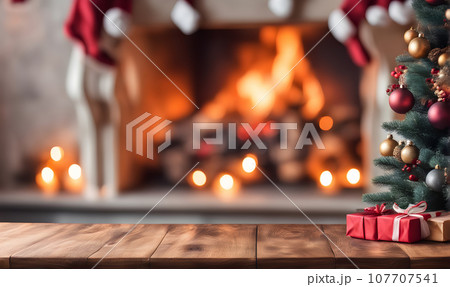 Christmas table with blurred fireplace backdrop 107707541