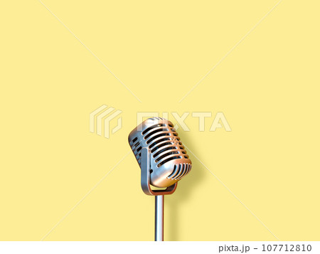 retro condenser microphone, isolated on yellow 107712810