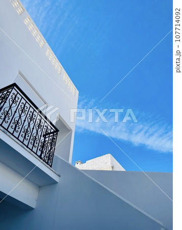 White house, typical architecture of the cubist city of Olhao. Portugal White house, typical architecture of the cubist city of Olhao. Portugal 107714092