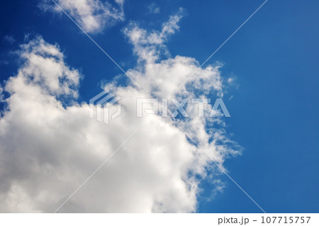 White clouds in a blue bright sky 107715757