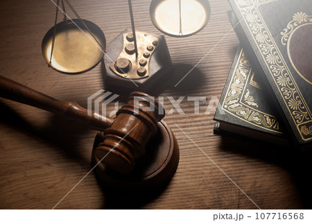 Judge gavel and legal book on wooden table Judge gavel and legal book on wooden table 107716568