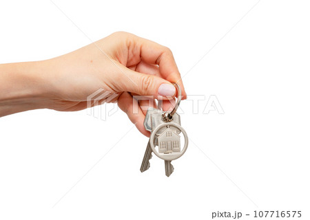 Woman holding keys with house shaped keychain 107716575