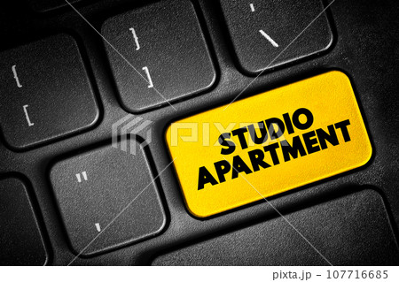 Studio Apartment in which the normal functions of a number of rooms often are combined into a single room, text button on keyboard, concept background Studio Apartment in which the normal functions of a number of rooms often are combined into a single room, text button on keyboard, concept background 107716685