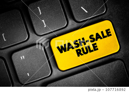 Wash-Sale Rule - if an investment is sold at a loss and then repurchased within 30 days, the initial loss cannot be claimed for tax purposes, text button on keyboard, concept background 107716892
