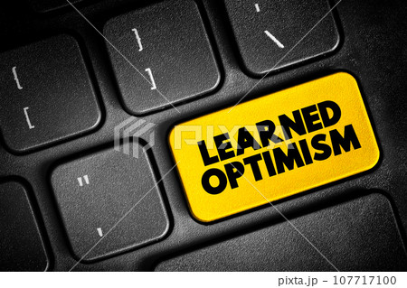Learned Optimism - developing the ability to view the world from a positive point of view, text button on keyboard, concept background 107717100