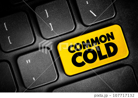 Common Cold is a viral infection of your nose and throat, upper respiratory tract, text button on keyboard, concept background 107717132