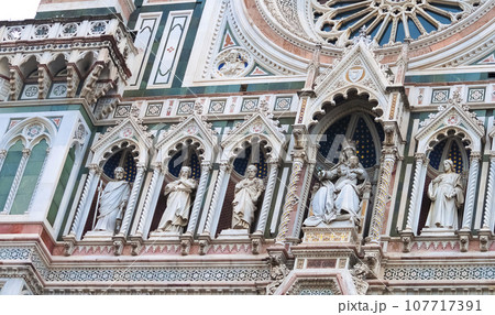 Details of the exterior of the di Santa Maria del Fiore or Cathedral of Saint Mary of the Flower - the main church of Florence, Tuscany, Italy. 107717391