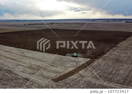 Agricultural machinery in the field, aerial view. Agricultural work. 107723417
