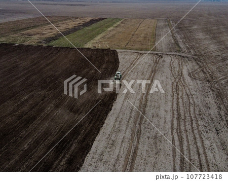 Agricultural machinery in the field, aerial view. Agricultural work. 107723418