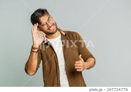 Happy Indian man showing ok gesture, like sign positive feedback , celebrate victory, approve idea Happy Indian man showing ok gesture, like sign positive feedback , celebrate victory, approve idea 107724779