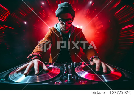 DJ working spinning turntable records at night club party 107725026
