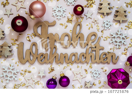 German Text Frohe Weihnachten, Means Merry Christmas In English, Flatlay German Text Frohe Weihnachten, Means Merry Christmas In English, Flatlay 107725876