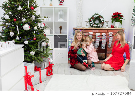 Children spend magical Christmas time with their moms Children spend magical Christmas time with their moms 107727094