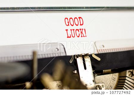 Good luck symbol. Concept words Good luck typed on beautiful old retro typewriter. Beautiful white paper background. Business, motivational good luck concept. Copy space. 107727492