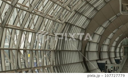 Modern architecture interior design of Metal structure building and glass at Suvarnabhumi Departure Terminal. Modern architecture interior design of Metal structure building and glass at Suvarnabhumi Departure Terminal. 107727779