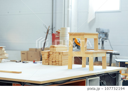 Manufactured small wooden ladder in a woodwork studio Manufactured small wooden ladder in a woodwork studio 107732194
