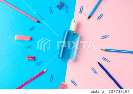 Hand sanitizer gel and school supplies top view 107732197