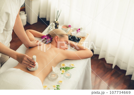 Hot herbal ball spa massage body treatment at day spa . Quiescent Hot herbal ball spa massage body treatment at day spa . Quiescent 107734669