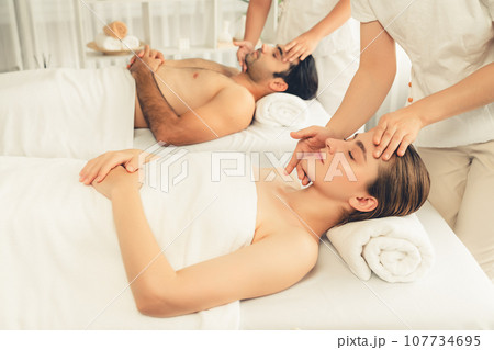 Caucasian couple enjoying relaxing anti-stress head massage. Quiescent 107734695