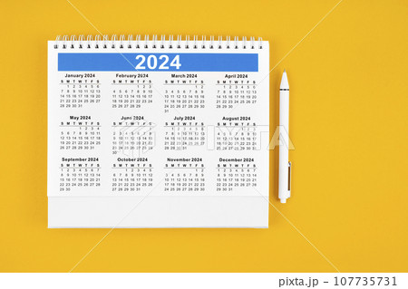 12 months desk calendar 2024 and pen. 107735731