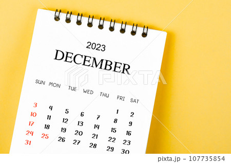 The December 2023 Monthly desk calendar for 2023 year on yellow background. The December 2023 Monthly desk calendar for 2023 year on yellow background. 107735854