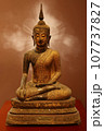 Buddha statue in subduing Mara 107737827