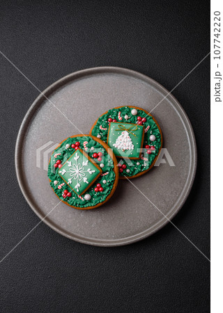 Beautiful festive Christmas gingerbread made by hand with decoration elements 107742220