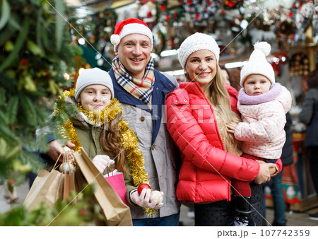 Family portrait at Christmas fair 107742359
