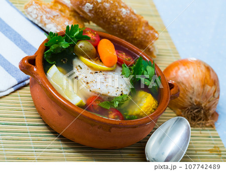 Fisherman's hoosh boiled with alaska pollock, carrots, corn and lemon Fisherman's hoosh boiled with alaska pollock, carrots, corn and lemon 107742489