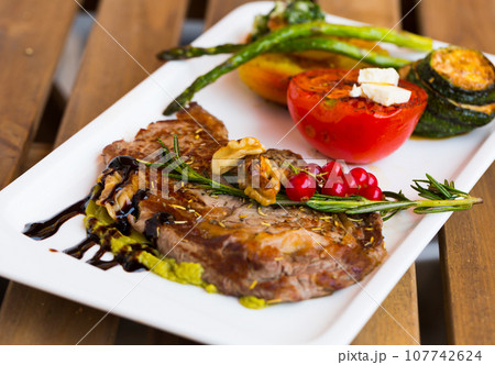 Veal with grilled vegetables Veal with grilled vegetables 107742624