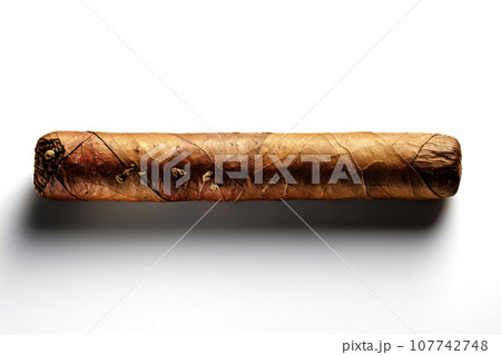 Isolated uncut cigar with light dirt on a white surface 107742748