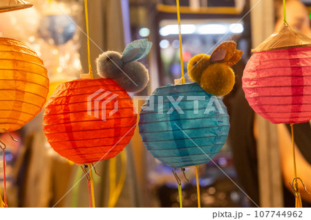 Closeup of Bamboo lantern with stuffed rabbit and flashing lights 107744962