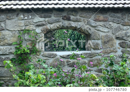 Mirror set into a niche in the stone wall 107746780