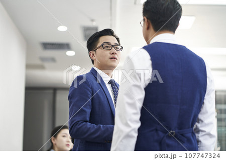 asian human resources manager meeting and chatting with candidate before interview asian human resources manager meeting and chatting with candidate before interview 107747324